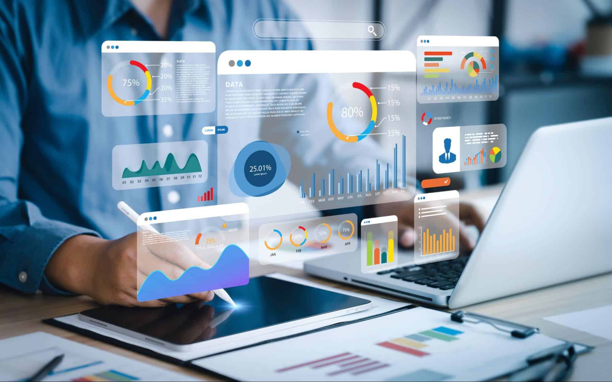 Financial Innovation at Your Fingertips: Embracing AI for Business Growth 1 A person uses a tablet and laptop surrounded by floating analytics graphs and charts